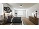 A furnished bedroom with large bed, dresser, and accent wall at 2252 Emerald Springs Dr, Apopka, FL 32712