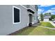 Modern home exterior boasts professional landscaping and a well-manicured lawn at 2252 Emerald Springs Dr, Apopka, FL 32712