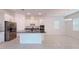 Bright kitchen with white cabinetry, stainless steel appliances, and a granite island at 2252 Emerald Springs Dr, Apopka, FL 32712