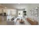 Comfortable living room open to the kitchen and dining area; features stylish decor at 2252 Emerald Springs Dr, Apopka, FL 32712