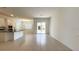 Open-concept space combining kitchen, dining, and living areas, featuring tile flooring at 2252 Emerald Springs Dr, Apopka, FL 32712