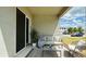 This outdoor patio features comfortable seating and view of the neighborhood at 2252 Emerald Springs Dr, Apopka, FL 32712