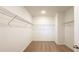 Walk-in closet features wire shelving and neutral carpet flooring at 2252 Emerald Springs Dr, Apopka, FL 32712