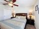 Well-lit bedroom with plush bedding, side tables, and neutral decor at 2530 Holtrock St, Kissimmee, FL 34747