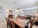 Spacious dining room with elegant furnishings and view into the foyer and living area at 2530 Holtrock St, Kissimmee, FL 34747