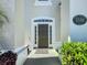 Inviting front door with sidelights and decorative address plaque at 2530 Holtrock St, Kissimmee, FL 34747