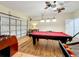 This game room features a pool table, foosball table, and garage door access at 2530 Holtrock St, Kissimmee, FL 34747