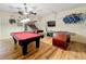 Game room featuring a pool table, foosball table, basketball hoops, and a TV at 2530 Holtrock St, Kissimmee, FL 34747
