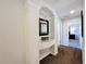 Hallway with a decorative alcove and access to other rooms in the house at 2530 Holtrock St, Kissimmee, FL 34747