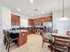 Open kitchen boasts stainless steel appliances, a breakfast bar, and adjacent dining area at 2530 Holtrock St, Kissimmee, FL 34747