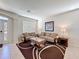 Cozy living room with tile flooring, sofas, stylish tables, and natural light at 2530 Holtrock St, Kissimmee, FL 34747