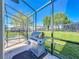 Enjoy outdoor grilling on the screened lanai, overlooking the backyard and in-ground spa at 2530 Holtrock St, Kissimmee, FL 34747