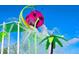 Whimsical purple flower water bucket dumping water at the Windsor Hills splashpad and playground at 2530 Holtrock St, Kissimmee, FL 34747