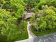 Aerial view of home with established trees and well-manicured landscaping at 25548 Pine Valley Dr, Mount Plymouth, FL 32776