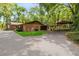 Charming brick home with paved driveway and covered parking at 25548 Pine Valley Dr, Mount Plymouth, FL 32776