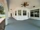 Covered back patio with ceiling fan, offering an outdoor living space at 25721 Pinehurst St, Sorrento, FL 32776