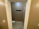 Neutral-toned bathroom features a toilet and coat rack, offering essential functionality at 25721 Pinehurst St, Sorrento, FL 32776