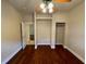 This bedroom features sleek wood floors, ceiling fan, closet space, and trim at 25721 Pinehurst St, Sorrento, FL 32776
