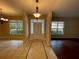 Spacious entryway with decorative tile flooring, views into multiple rooms and a front door at 25721 Pinehurst St, Sorrento, FL 32776