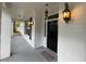 Inviting front porch with stylish lanterns and new paint at 25721 Pinehurst St, Sorrento, FL 32776