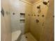 The shower features dual shower heads and tile accents, offering luxury and style at 25721 Pinehurst St, Sorrento, FL 32776