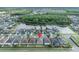 An aerial view of neighborhood homes near a lake, centered with a pin marker on the subject home at 2607 Quail Pond Way, Kissimmee, FL 34743