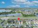 An aerial view of neighborhood homes near a lake, centered with a pin marker on the subject home at 2607 Quail Pond Way, Kissimmee, FL 34743