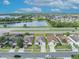 Aerial shot of home highlighting its proximity to a lake, main road, and surrounding neighborhood at 2607 Quail Pond Way, Kissimmee, FL 34743