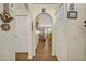Hallway featuring decorative arches and doors leading to various rooms, highlighting the layout at 2607 Quail Pond Way, Kissimmee, FL 34743