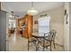 Eat-in kitchen with a round table, tile floors, and stainless appliances at 2607 Quail Pond Way, Kissimmee, FL 34743