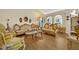 Elegant living room showcases hardwood floors and classic, ornate furniture at 2607 Quail Pond Way, Kissimmee, FL 34743
