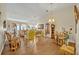 Bright living room with hardwood floors, showcasing a mix of classic and modern decor at 2607 Quail Pond Way, Kissimmee, FL 34743