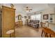 Relaxing living room offers wood-look tile flooring, a ceiling fan, and comfortable seating at 2607 Quail Pond Way, Kissimmee, FL 34743