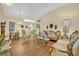 Living room features a mix of classic furnishings and hardwood floors, creating a warm ambiance at 2607 Quail Pond Way, Kissimmee, FL 34743