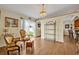 Cozy sitting area with ornate decor, chandelier, and views of the lush backyard at 2607 Quail Pond Way, Kissimmee, FL 34743