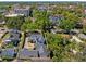 Aerial view showcasing the home's layout, surrounding trees, and proximity to the city at 266 Chase Ave, Winter Park, FL 32789