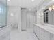 Spacious bathroom with double sinks, custom cabinetry, and a separate water closet for added privacy at 266 Chase Ave, Winter Park, FL 32789