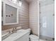 Bathroom featuring a stylish sink and shower with wood-look tile and glass door at 266 Chase Ave, Winter Park, FL 32789