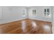 Well-lit bedroom with hardwood floors and large windows offering natural light and a serene atmosphere at 266 Chase Ave, Winter Park, FL 32789