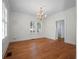 Elegant dining room featuring hardwood floors, a chandelier, and a window providing natural light at 266 Chase Ave, Winter Park, FL 32789