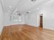 Open living room featuring hardwood floors, tray ceilings, and large shuttered windows at 266 Chase Ave, Winter Park, FL 32789