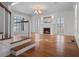 Open living room showcasing hardwood floors, fireplace, and French doors for a bright and elegant space at 266 Chase Ave, Winter Park, FL 32789
