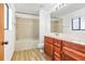 Bright bathroom boasts vanity with a countertop, tiled shower and tub combo at 271 Morning Glory Dr, Lake Mary, FL 32746
