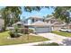 Charming two-story home with a well-manicured lawn and two car garage at 271 Morning Glory Dr, Lake Mary, FL 32746