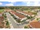 Aerial view of white homes with terracotta roofs and manicured landscaping in Sweetwater community at 2710 Bolzano Dr, Apopka, FL 32712