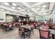 Open bar area featuring TVs, wood floors, ample seating, and a lively social atmosphere at 2710 Bolzano Dr, Apopka, FL 32712