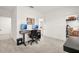 Well-organized bedroom featuring a desk setup, dual monitors, and easy access to a walk-in closet at 2710 Bolzano Dr, Apopka, FL 32712