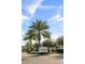 Gated entrance to Sweetwater The Estates & The Reserve Golf & Country Club with lush landscaping and palm trees at 2710 Bolzano Dr, Apopka, FL 32712