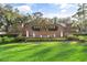 Brick sign for the Sweetwater Club with water feature and manicured lawn at 2710 Bolzano Dr, Apopka, FL 32712