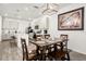 Dining area with a table, kitchen view, and modern light fixtures at 2710 Bolzano Dr, Apopka, FL 32712